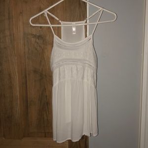 Cute white summer tank top with lace detailing.